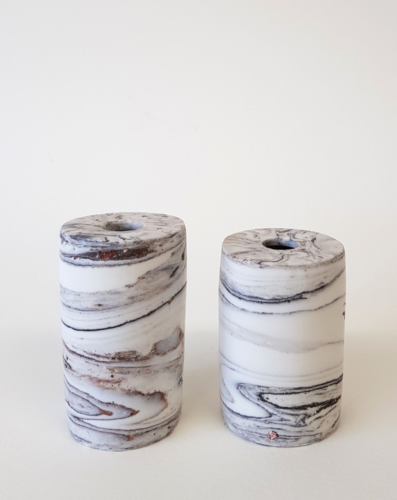 Porcelain ink wells made with found materials and polished
